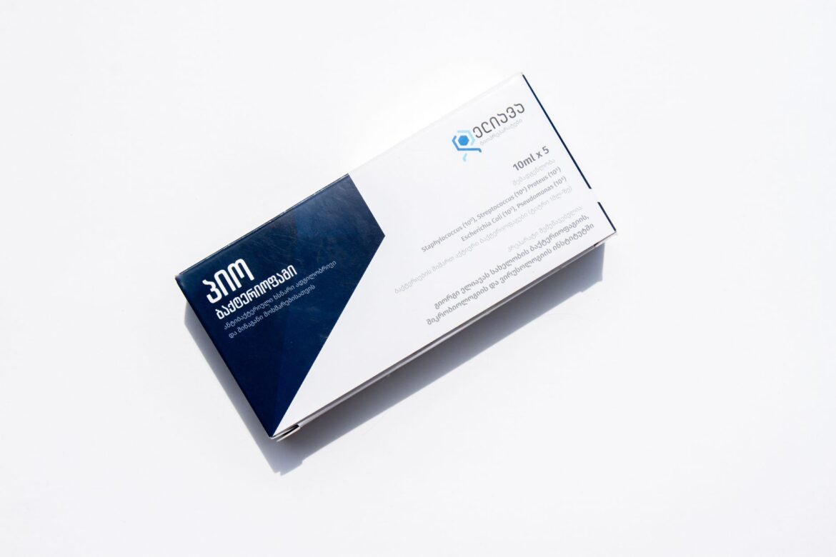 A medicine box with English and Georgian text, isolated on a white background for healthcare purposes.